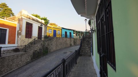 Dominican Republic, Santo Domingo - January 28, 2022: Beautiful color houses on the Hostos street in a Colonial city