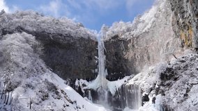 Waterfall Kegon with snowy basalt wall, Japan. Almost frozen waterfall. Kegon fall in winter. High quality slowmotion footage. Snow everywhere. - Powered by Shutterstock - Get 15% off with code: PIKWIZARD15