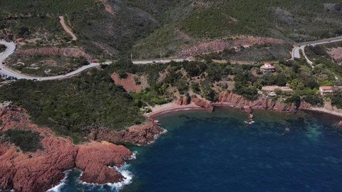 Aerial fly over view of the Massif de L'Esterel on the coast of the Mediterranean Sea and the road to Saint Tropez from Cannes in the French Riviera