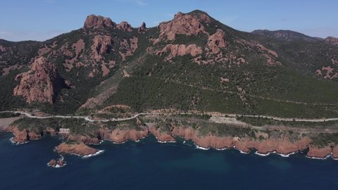 Aerial fly over view of the Massif de L'Esterel on the coast of the Mediterranean Sea and the road to Saint Tropez from Cannes in the French Riviera