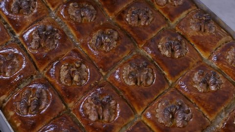 Delicious Azerbaijani baklava with walnut pouring sweet syrup, Close-up top view