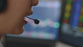 Close up of young Asian woman broker wearing headphone, call center, customer service talking with customer and trading stock. - Powered by Shutterstock - Get 15% off with code: PIKWIZARD15