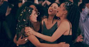 The night may not last forever but the memories will. 4k video footage of young women dancing together at a party surrounded by falling confetti.