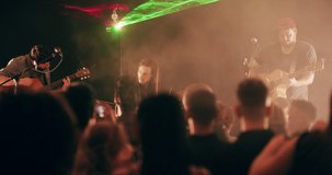 One night, lots of awesome memories. 4k video footage of a crowd of people photographing a live musical performance with their smartphones.