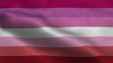 Lesbian flag waving in the wind with high-quality texture in 4K. LGBT, lesbian, gay, bisexual, transgender social movements. Concept of happiness freedom love same-sex couple
