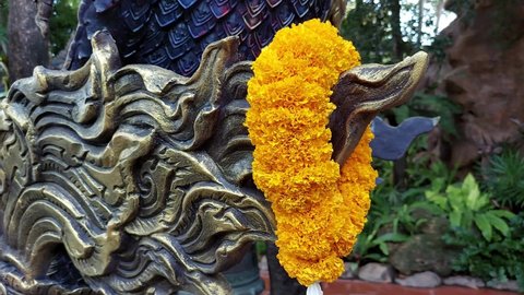 Big mythical snake statue called Naga at Wat Tha Mai is a Buddhist temple in Krathum Baen, Samut Sakhon, Thailand. APRIL 2022