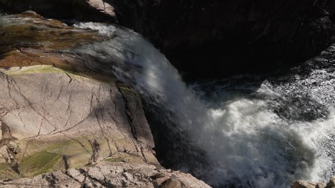Waterfall in Glencoe, Scotland, in dappled sunlight. April 23 2022.