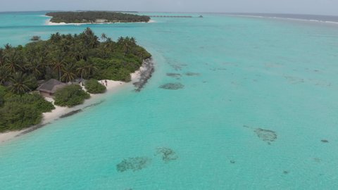 Aerial drone view of a beautiful resort island in the Maldives, Ari Atoll Sun island 4K
