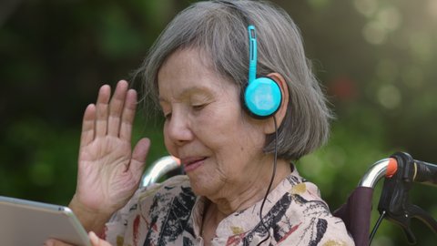Music therapy in dementia treatment on elderly woman.