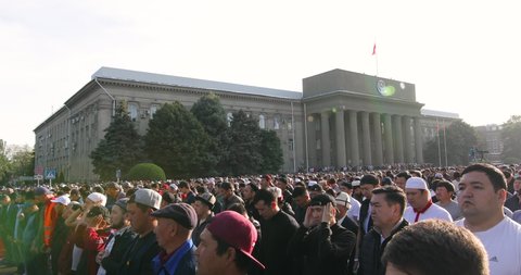 Bishkek, Kyrgyzstan - May 1, 2022: Muslim prayers celebrating Eid al-Fitr which marks the end of the month of Ramadan in Bishkek city central square