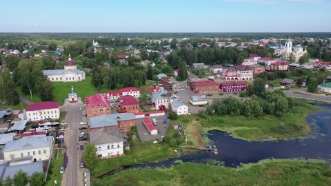 Aerial panoramic view of Russian town of Myshkin on banks of Volga River on summer day overlooking Assumption Cathedral and Nikolskaya church, Yaroslavl Oblast