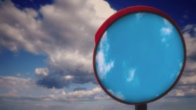 Traffic Mirror Cloudy Sky Reflection Concept. Convex traffic mirror reflection the cloudy blue sky in the background. - Powered by Shutterstock - Get 15% off with code: PIKWIZARD15