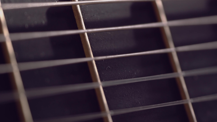 Playing Acoustic Guitar close up of Strings vibrating. Abstract defocused field of view.  Royalty-Free Stock Footage #1089810349