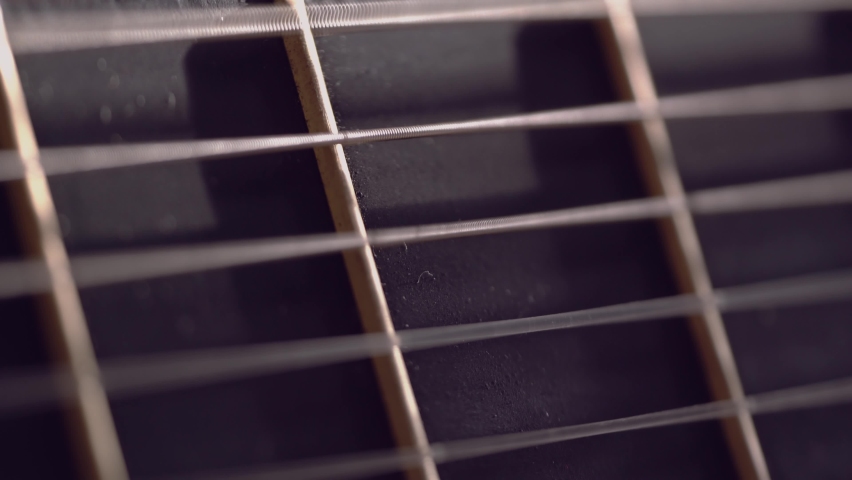 Playing Acoustic Guitar close up of Strings vibrating. Abstract defocused field of view.  | Shutterstock HD Video #1089810349