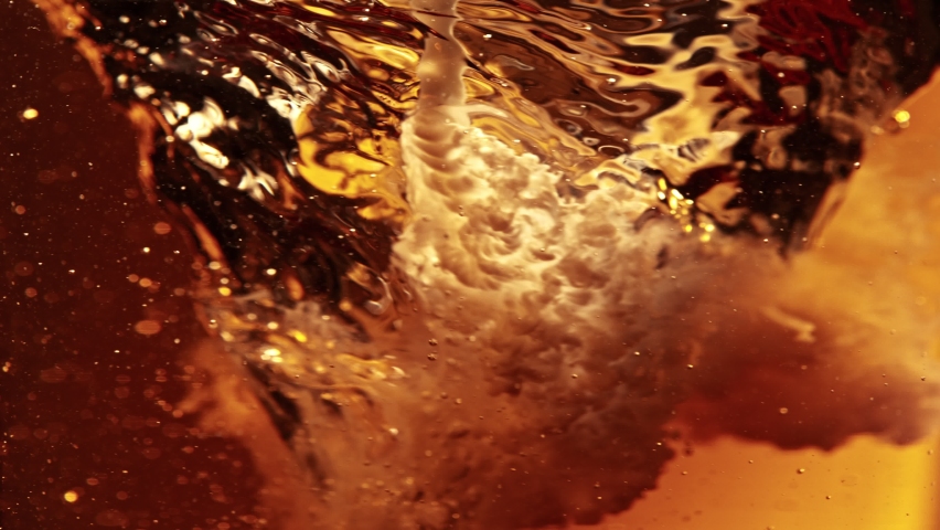 Super Slow Motion Shot of Pouring Cream or Milk into Coffee Whirl at 1000fps. Royalty-Free Stock Footage #1089811087