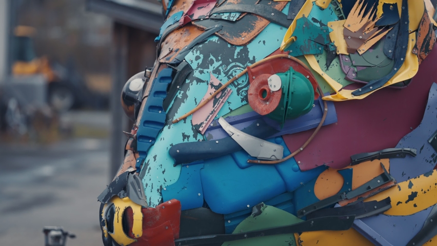 A close-up of the sculpture made out of garbage. Slow-motion, zoom out.