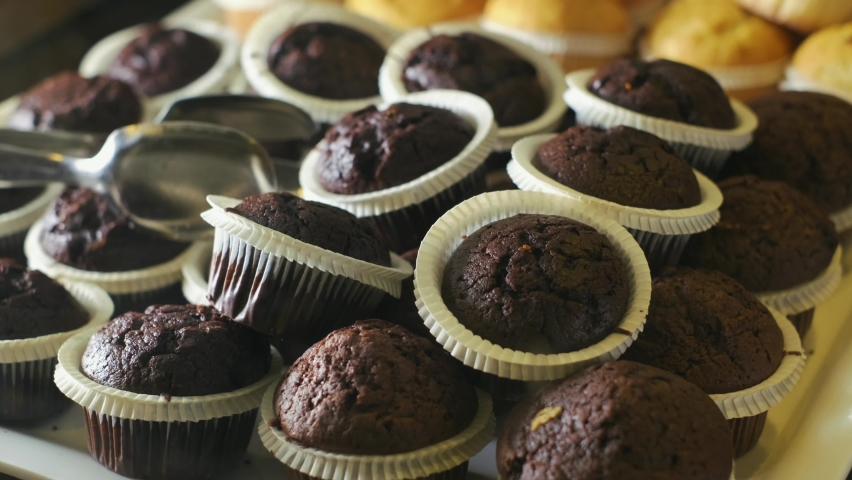 Cupcakes in Patisserie Display. slow motion. 4K