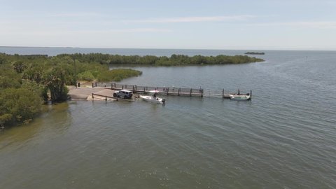 Boat launch to the ocean in the middle of mangroves in Florida, aerial view