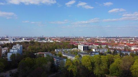 A path through the woods in a park, panorama sky Breathtaking aerial view flight slowly tilt up drone flight of Berlin Tempelhof Park District Spring 2022. Cinematic view from above by Philipp Marnitz