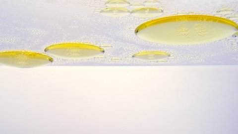 Oil drop floating on water surface.