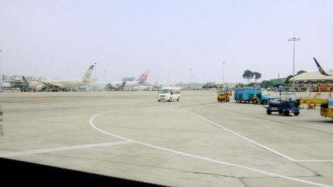A view of parked planes taken shot from inside an airport bus that takes people to the planes after checking in for a flight at Ho Chi Minh Airport, Asia, Saigon, Vietnam, April 10, 2022.