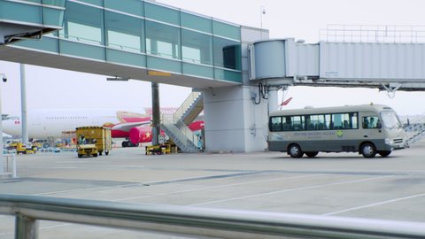 Airport special services buses deliver everything necessary for flights to aircraft at Ho Chi Minh Airport, Asia, Saigon, Vietnam, April 10, 2022