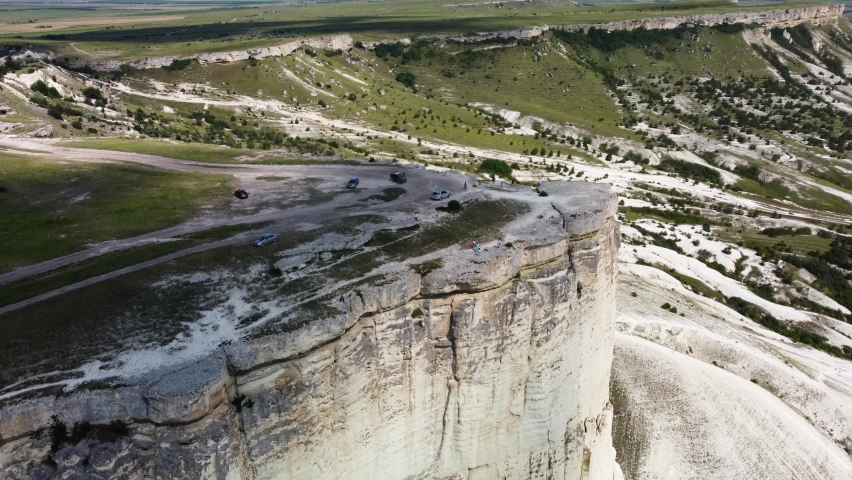 white chalk limestone rock against a blue sky aerial view