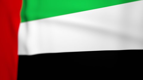 Waving colorful flag of United Arab Emirates. Emirate flag is blowing in the wind