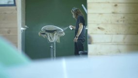 Surfboard manufacturing, Shaper paints a surfboard. Concept of surfing industry production, modern active lifestyle, skilled professional, millennial worker in America.  - Powered by Shutterstock - Get 15% off with code: PIKWIZARD15