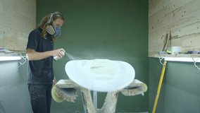 Making a surfboard, Shaper paints a surfboard. Concept of surfing industry production, skilled professional in America, millennial lifestyle, surfing manufacturing in USA.  - Powered by Shutterstock - Get 15% off with code: PIKWIZARD15