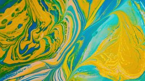Fluid art painting. Background with liquid acrylic colors. Mixed paints. Abstract drawing. Modern art. Slow motion video. 
