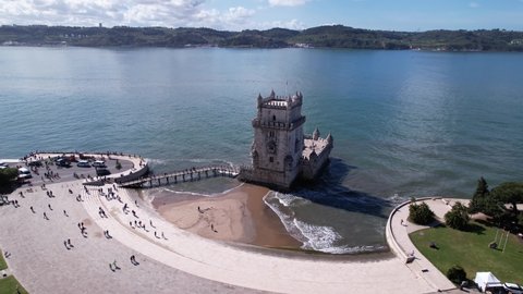 DRONE AERIAL FOOTAGE: The Belem Tower (Torre de Belém) was built between 1514 and 1520 in a Manueline style by the Portuguese architect and sculptor Francisco de Arruda.