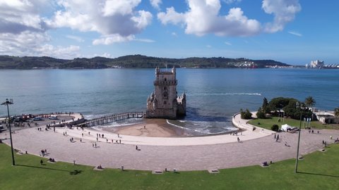 DRONE AERIAL FOOTAGE: The Belem Tower (Torre de Belém) was built between 1514 and 1520 in a Manueline style by the Portuguese architect and sculptor Francisco de Arruda.