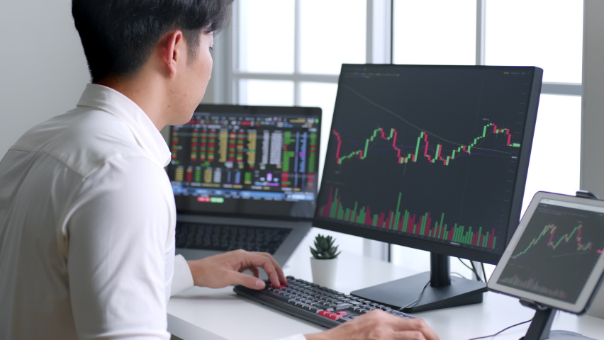 Young Asian investor watching the change of stock market on computer laptop screen. | Shutterstock HD Video #1089827487