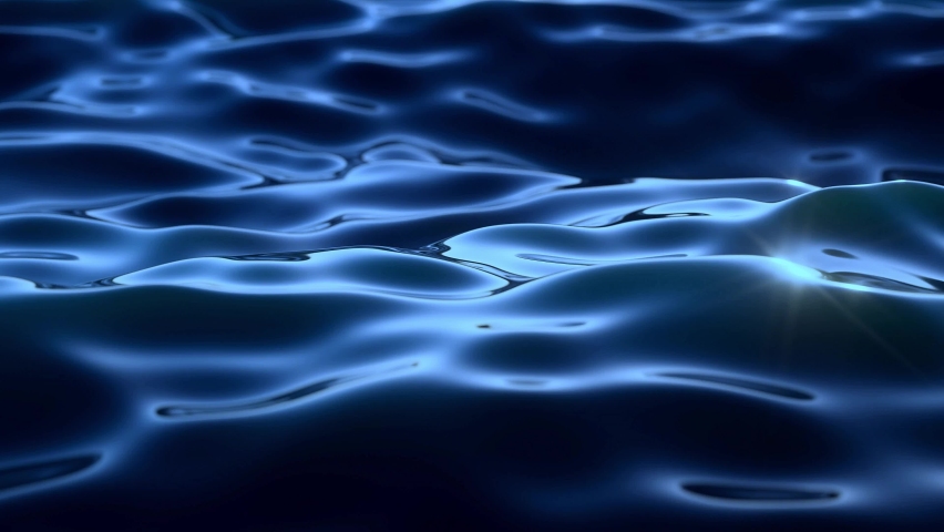 the dark blue rippling waters of the sea under the sun