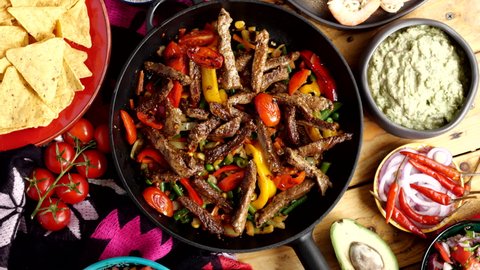 Fajitos fajita fajitas is a popular Mexican dish of meat and vegetables, cut into strips and grilled