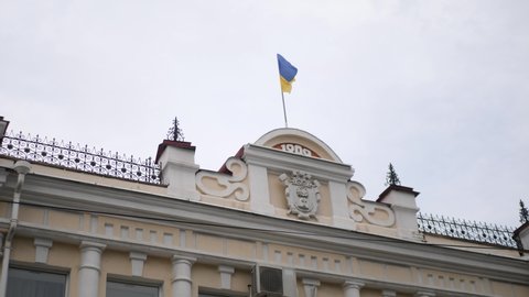 MELITOPOL, ZAPORIZHIA OBLAST, UKRAINE - JUNE 22, 2021: Melitopol City Council building with Ukrainian flag