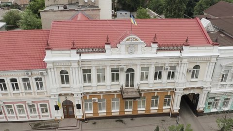 MELITOPOL, ZAPORIZHIA OBLAST, UKRAINE - JUNE 22, 2021: Melitopol City Council building with Ukrainian flags