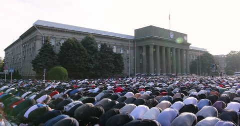 Bishkek, Kyrgyzstan - May 1, 2022: Muslim prayers celebrating Eid al-Fitr which marks the end of the month of Ramadan in Bishkek city central square