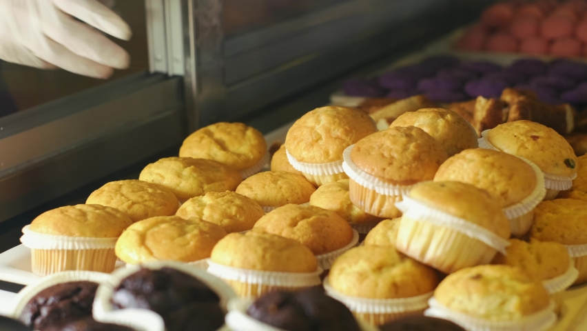 Pastries and Cupcakes in Patisserie Display. slow motion.4K