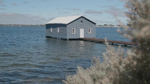 A stationary footage of the Crawley Edge Boatshed, commonly referred to as the Blue Boat House, is a boathouse located on the Swan River at Crawley in Perth, Western Australia. Was built in the 1930s.