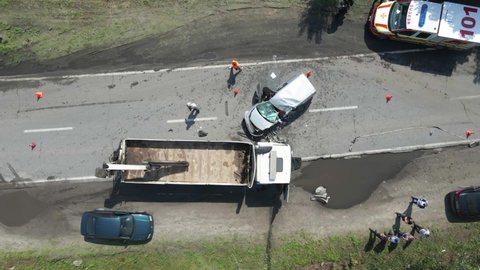 The truck and the car collided on the highway. Strong accident. Traffic accidents on the road. View from above. Traffic jam on the road. DNIPRO, UKRAINE – August 11, 2021