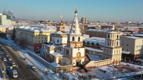 Aerial around view on the Cathedral of the Epiphany and Angara river in Irkutsk, Russia, 4k