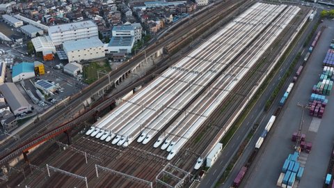 Osaka, Japan - April 15 2022: Nozomi Shinkansen Bullet Trains, Aerial 4k Pan Establishing Shot