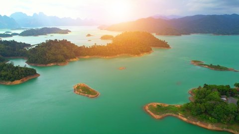 Aerial view of the lake among mountains and many islands. Landscape of Green and turquoise. Ratchaprapha dam, Surat Thani Province, Thailand. Aerial view 4K.
