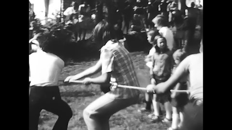 milan, italy june 16 1970:boys playing tug of war in black and white 70s