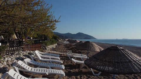 Beach umbrellas and sun loungers. High quality 4k footage