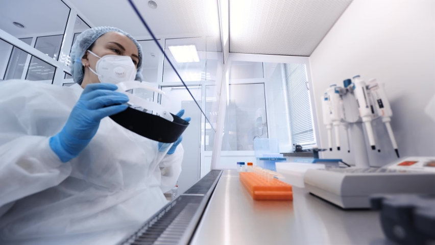 a female scientist makes PCR DNA tests in a modern chemical and bacteriological laboratory. Royalty-Free Stock Footage #1089840763