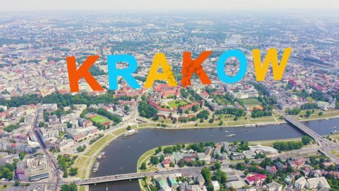 Inscription on video. Krakow, Poland. Wawel Castle. Ships on the Vistula River. View of the historic center. Different colors letters appears behind small squares, Aerial View, Departure of the camer
