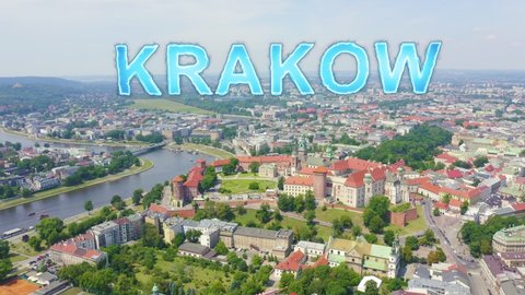 Inscription on video. Krakow, Poland. Wawel Castle. Ships on the Vistula River. View of the historic center. Arises from blue water, Aerial View, Point of interest